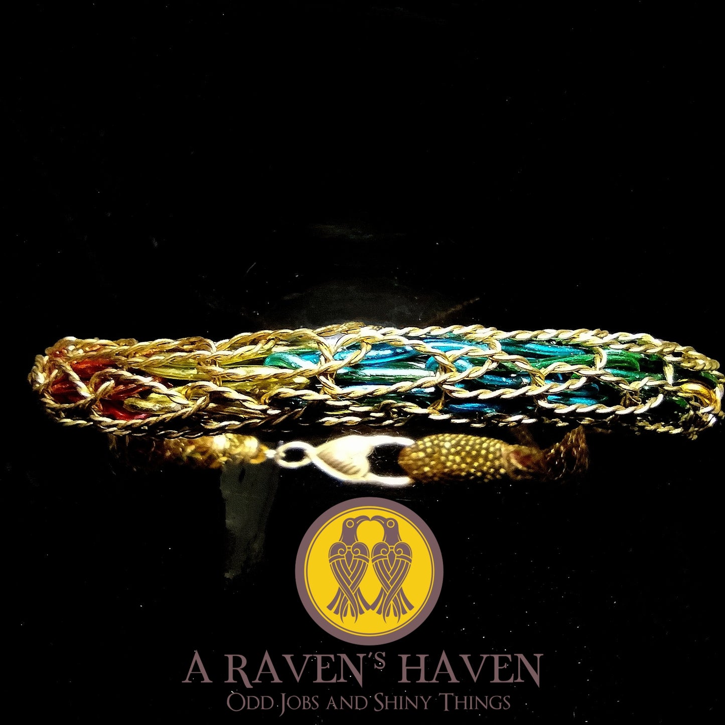 The Protect the Pride Series - Gold-Plated Copper Bracelet with Tight Rainbow Rope Weave Within Heart Clasp and Snake Head Accent
