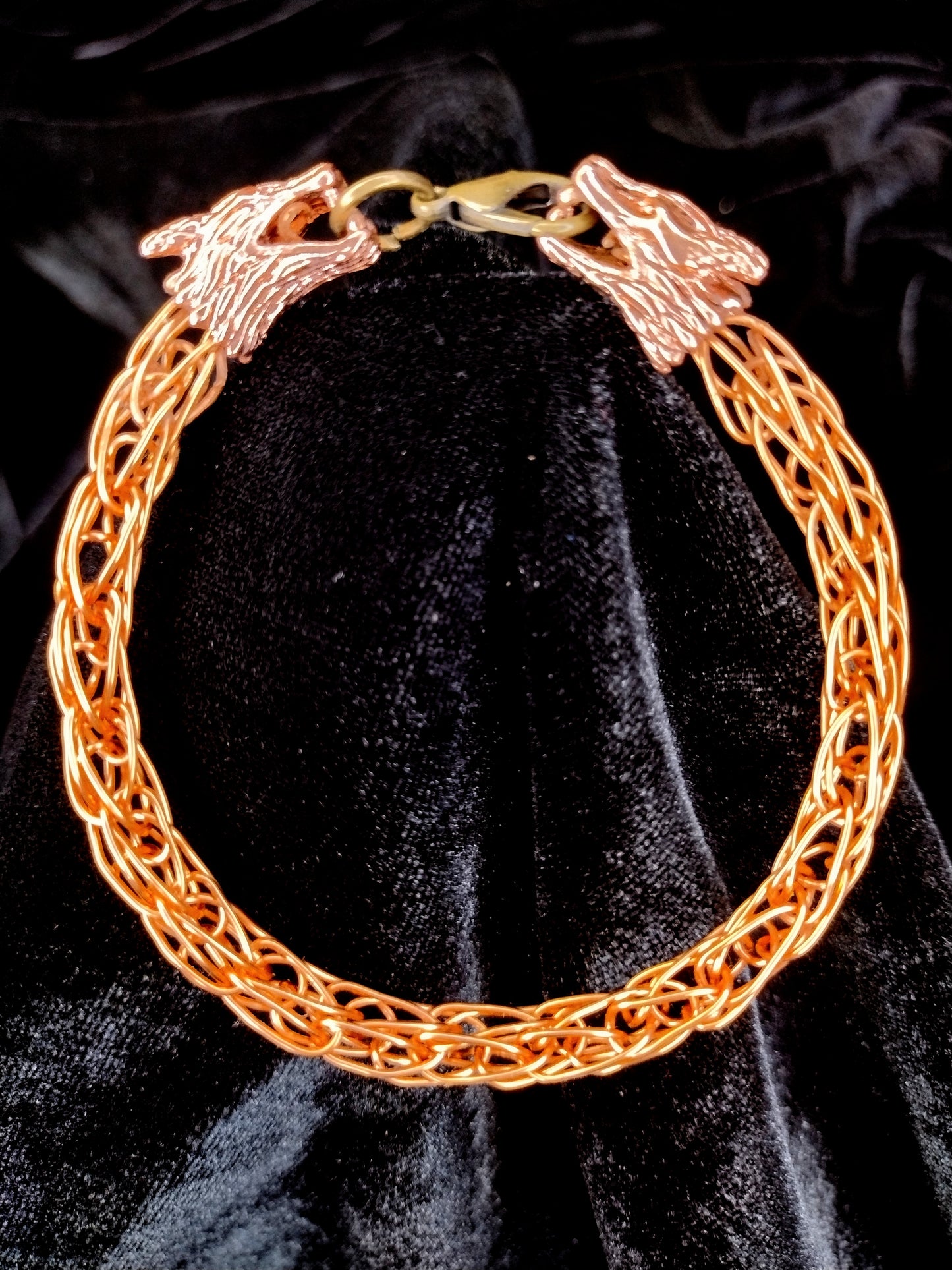 Handcrafted woven copper bracelet with dragon end caps, bronze colored copper