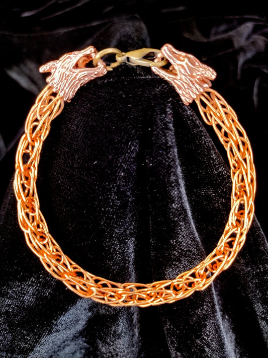 Handcrafted woven copper bracelet with dragon end caps, bronze colored copper