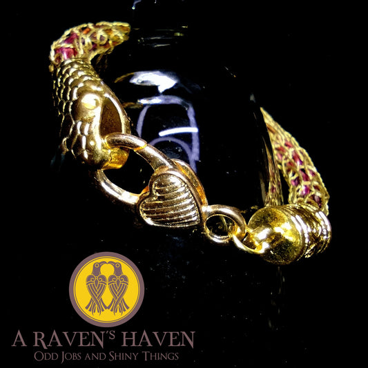 The Protect the Pride Series - Gold-Plated Copper Bracelet with Tight Rainbow Rope Weave Within Heart Clasp and Snake Head Accent
