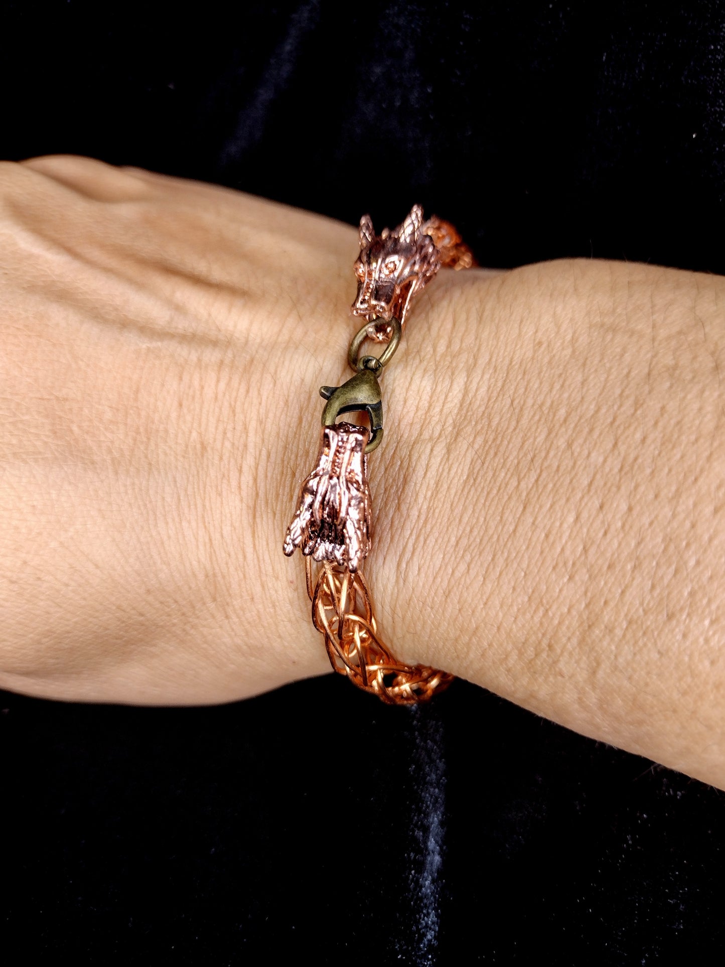 Handcrafted woven copper bracelet with dragon end caps, bronze colored copper