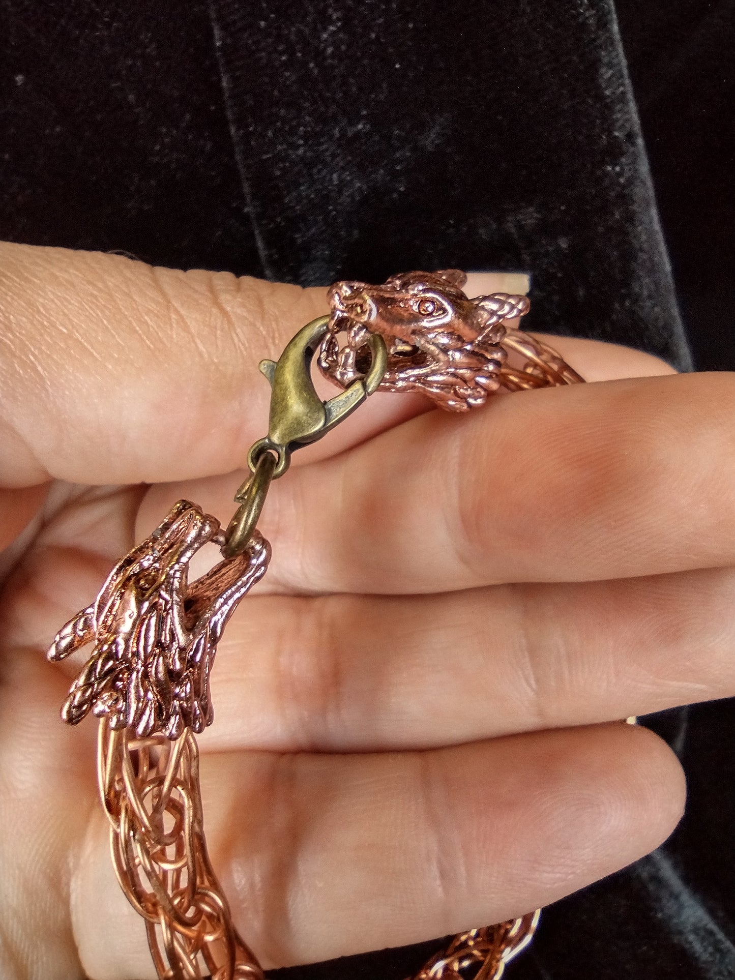 Handcrafted woven copper bracelet with dragon end caps, bronze colored copper