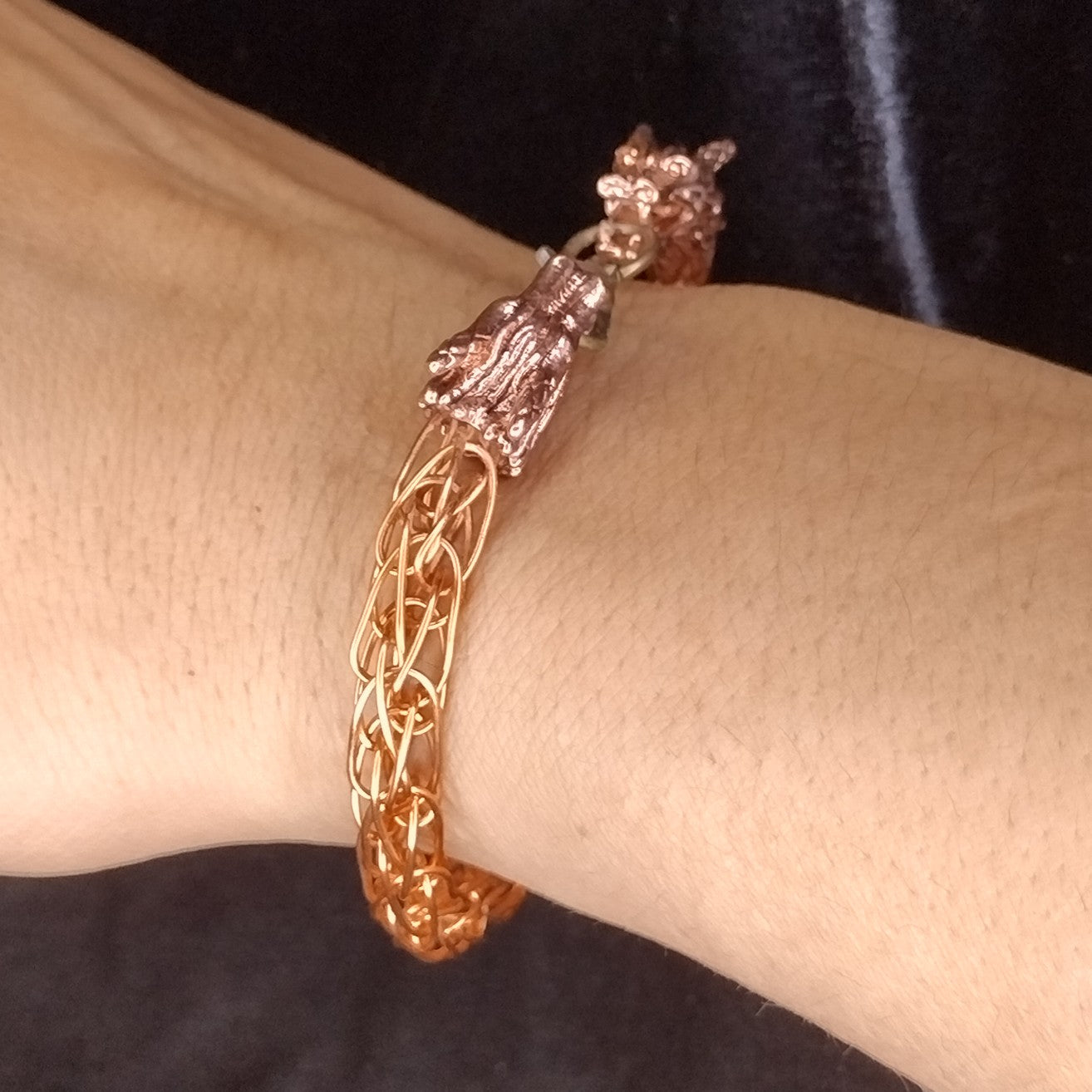 Handcrafted woven copper bracelet with dragon end caps, bronze colored copper