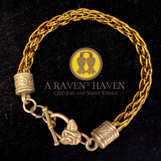 Bronze Handwoven medium weave bracelet with bronze rose accents and toggle clasp
